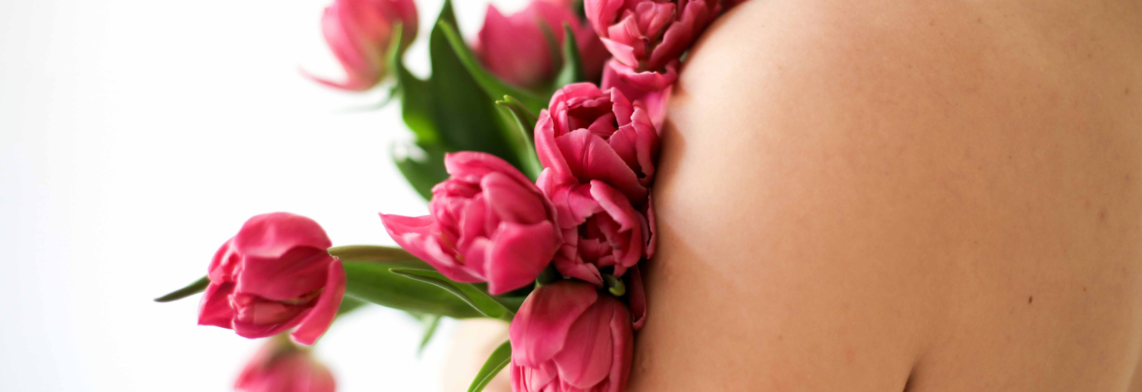 Image of woman with flowers on her arm
