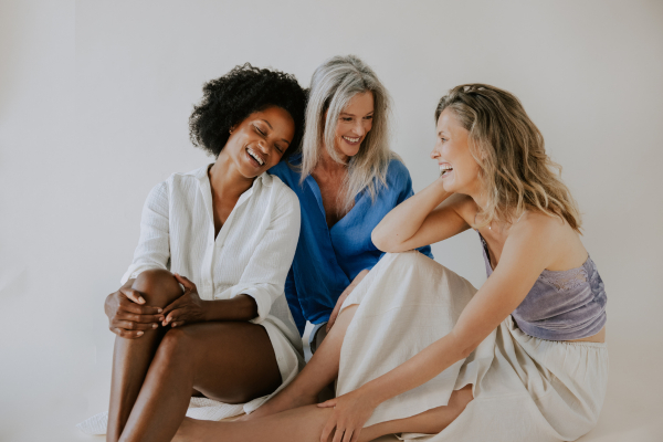 photo of women of different ages, smiling