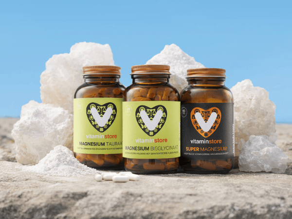 three magnesium supplements on stones with a blue sky background